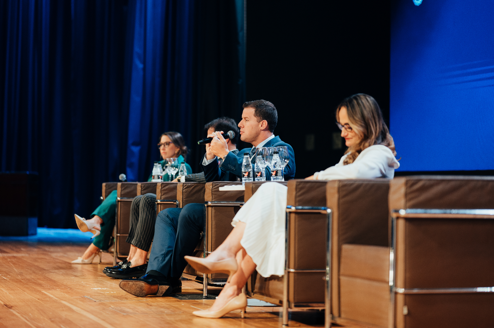Mesa de palestrantes no Congresso MFI